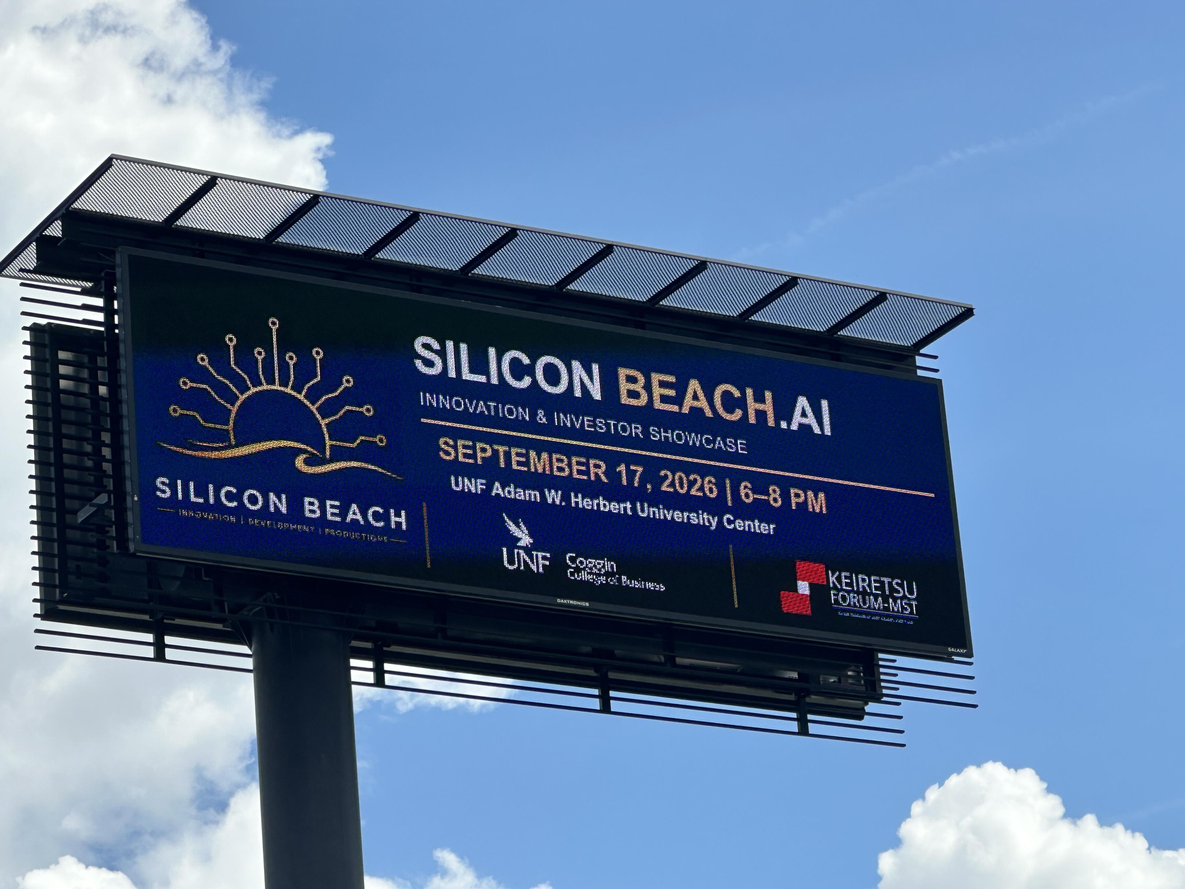 Silicon Beach Innovation and Investor Showcase billboard against a blue sky in Jacksonville