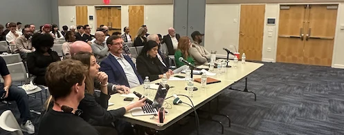 Panelists seated at the February pitch event